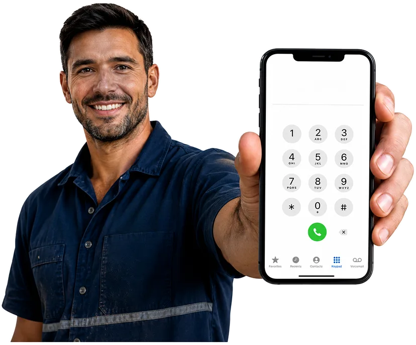 Plumber on the phone taking a Kensington callout